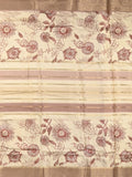 Dola silk fancy saree cream and peach color allover prints & zari border with printed pallu and printed blouse