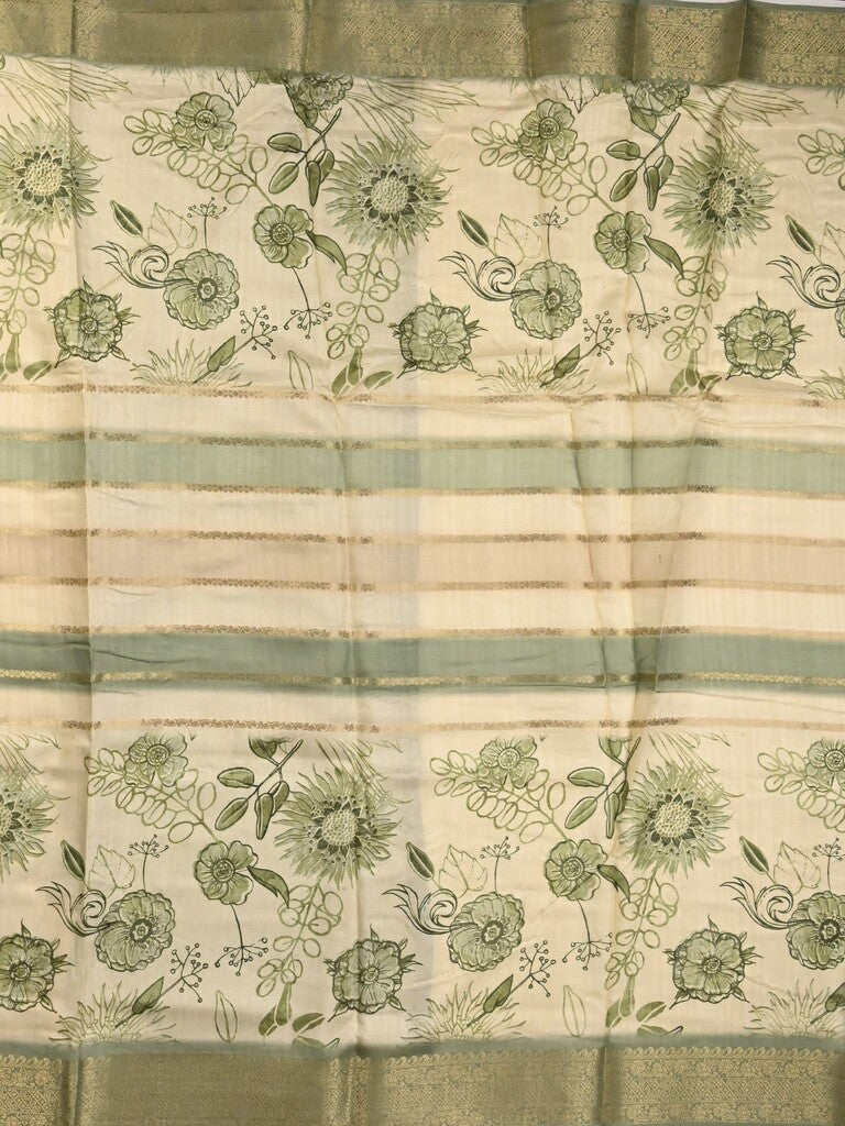 Dola silk fancy saree cream and green color allover prints & zari border with printed pallu and printed blouse