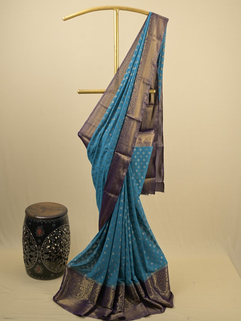 Georgette fancy saree blue color allover zari motifs & zari border with rich pallu and attached plain blouse