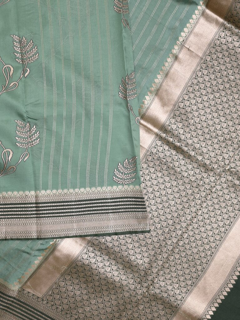 Tabby silk printed fancy saree with zari border and attached plain blouse