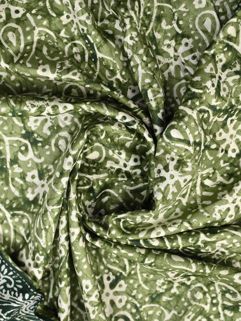 Dola silk fancy saree light green color allover prints & zari border with printed pallu and printed blouse