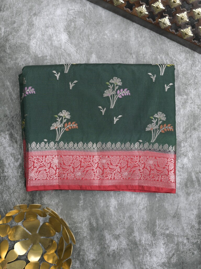 Raw mango fancy saree in dark green color with allover zari motifs and zari border with brocade pallu & blouse