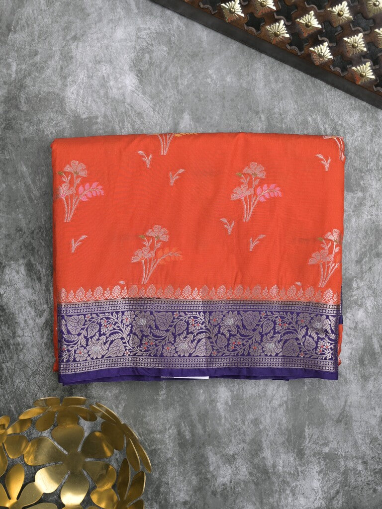 Raw mango fancy saree in orange color with allover zari motifs and zari border with brocade pallu & blouse