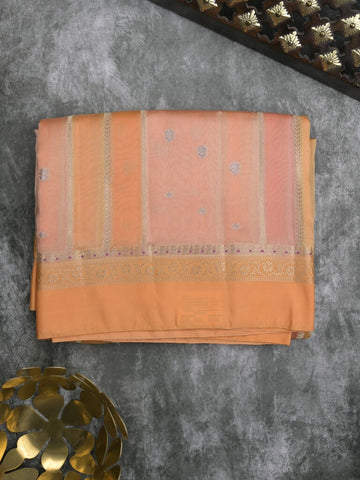 Raw mango fancy saree in peach color with allover zari weaves and zari border with brocade pallu & blouse