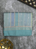 Raw mango fancy saree in light blue color with allover zari weaves and zari border with brocade pallu & blouse