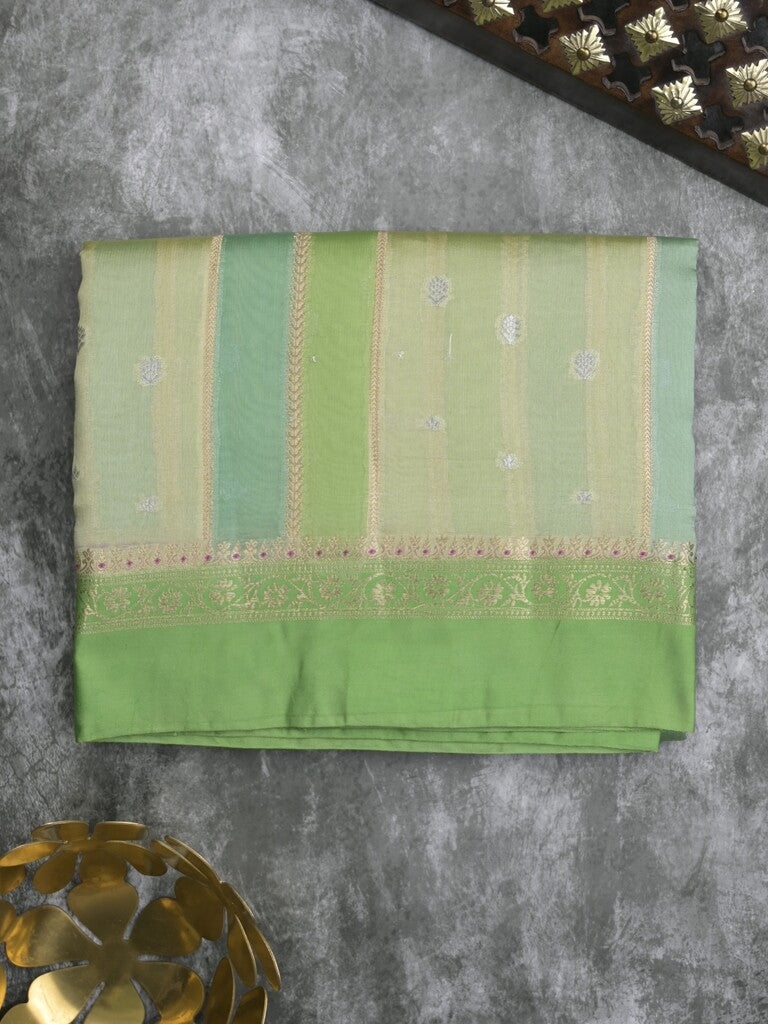 Raw mango fancy saree in pista green color with allover zari weaves and zari border with brocade pallu & blouse