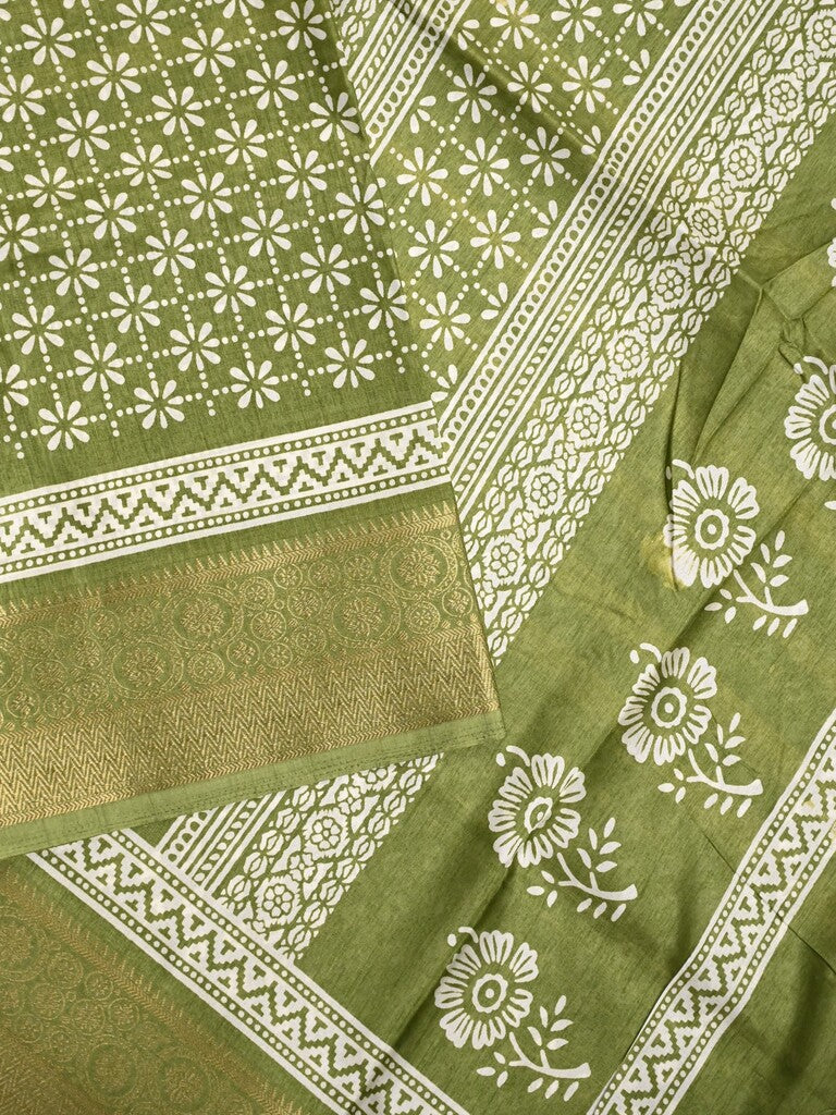 Dola silk fancy saree light green color allover prints & zari border with printed pallu and printed blouse