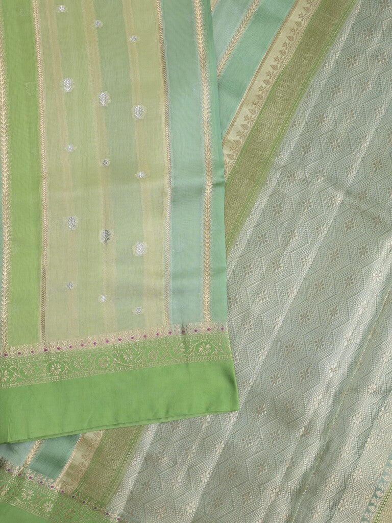 Raw mango fancy saree in pista green color with allover zari weaves and zari border with brocade pallu & blouse