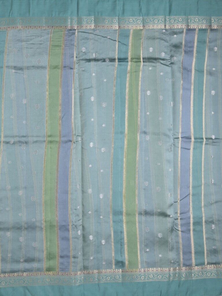 Raw mango fancy saree in light blue color with allover zari weaves and zari border with brocade pallu & blouse