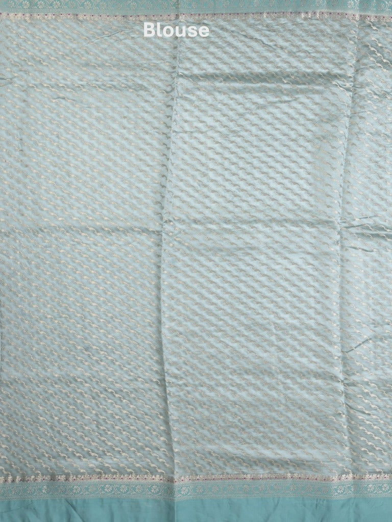 Raw mango fancy saree in light blue color with allover zari weaves and zari border with brocade pallu & blouse