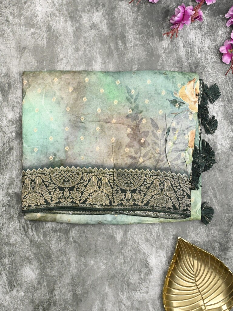Dola silk fancy saree sea green color allover prints & zari border with rich pallu and contrast plain blouse