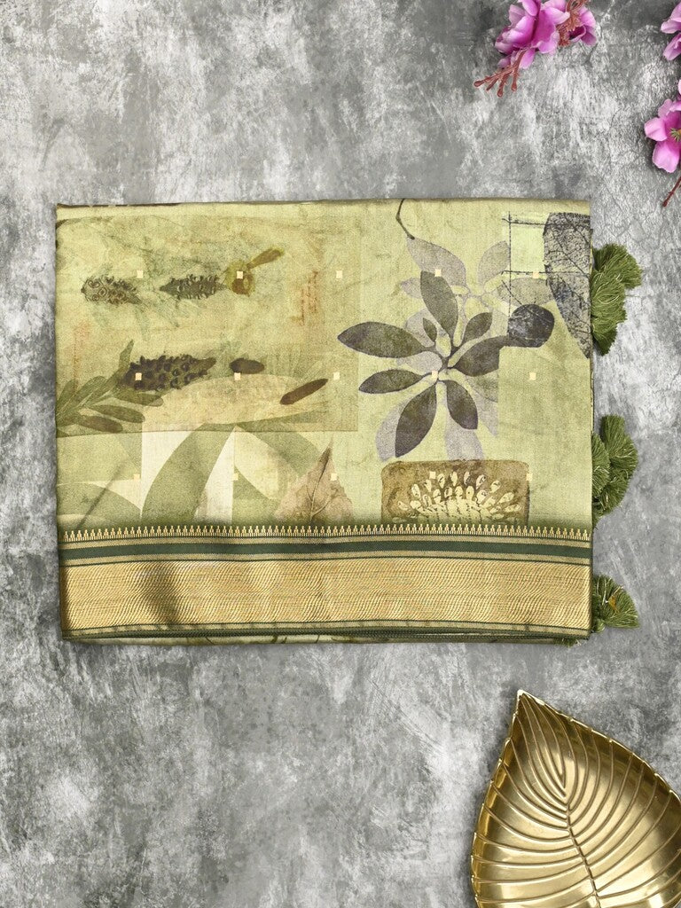 Dola silk fancy saree light olive green color allover prints & zari border with rich pallu and contrast plain blouse