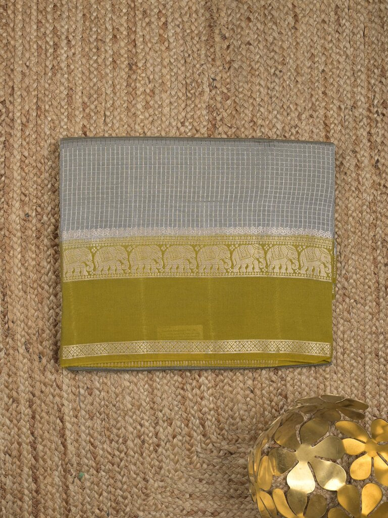Dupion fancy saree allover checks & contrast border with zari pallu and plain blouse