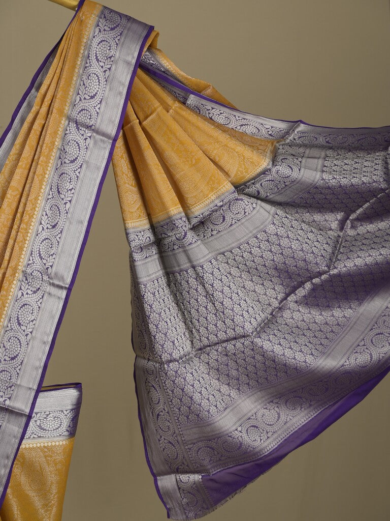 Georgette fancy saree golden yellow color allover weaves & zari border with rich pallu and plain blouse