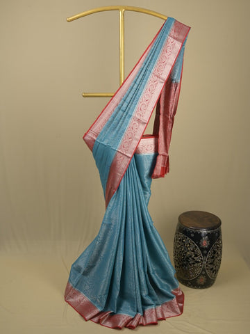 Georgette fancy saree sky blue color allover weaves & zari border with rich pallu and plain blouse