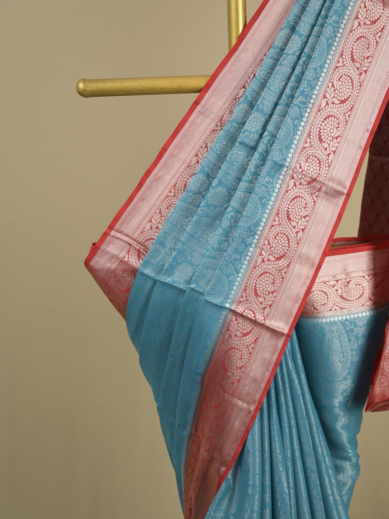 Georgette fancy saree sky blue color allover weaves & zari border with rich pallu and plain blouse