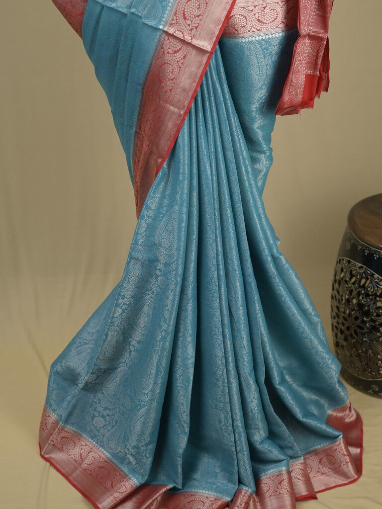 Georgette fancy saree sky blue color allover weaves & zari border with rich pallu and plain blouse