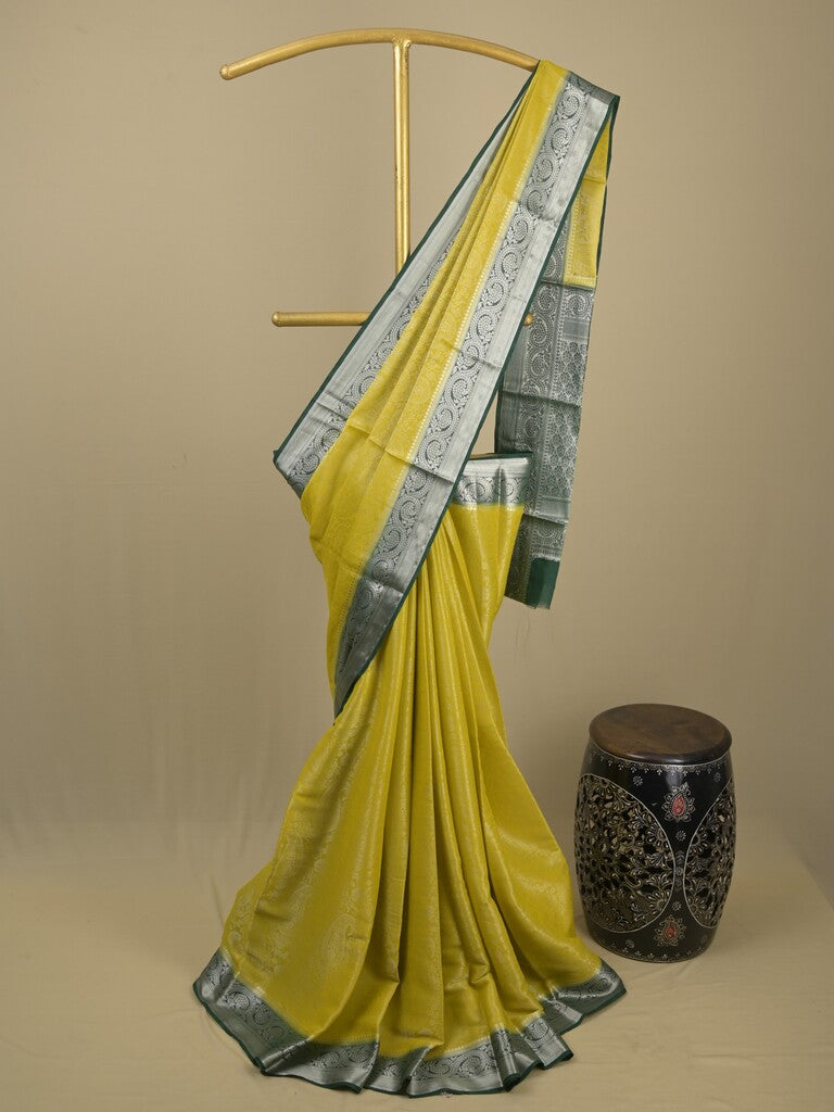 Georgette fancy saree yellowish green color allover weaves & zari border with rich pallu and plain blouse