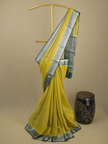 Georgette fancy saree yellowish green color allover weaves & zari border with rich pallu and plain blouse