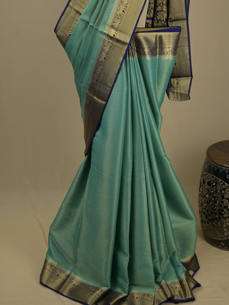Georgette fancy saree lux green color allover weaves & zari border with rich pallu and plain blouse