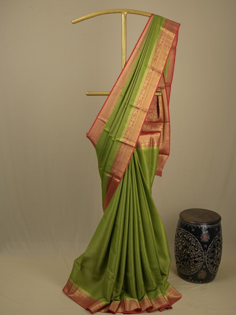Georgette fancy saree parrot green color allover weaves & zari border with rich pallu and plain blouse