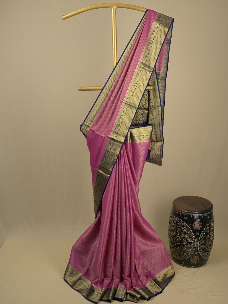 Georgette fancy saree purple color allover weaves & zari border with rich pallu and plain blouse