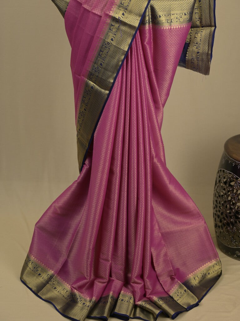 Georgette fancy saree purple color allover weaves & zari border with rich pallu and plain blouse