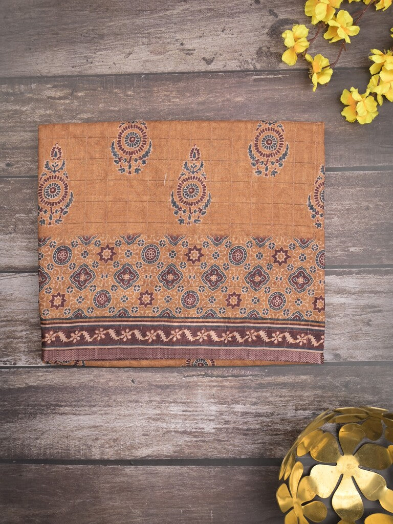 Tussar fancy saree light brown color allover prints & small kaddi border with short printed pallu and attached blouse