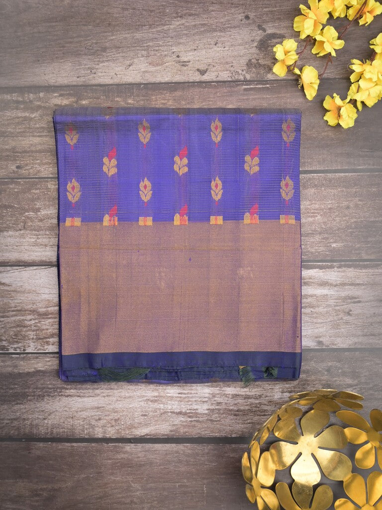 Uppada pattu saree peacock blue color allover zari motifs & long kaddi border with rich pallu and contrast plain blouse