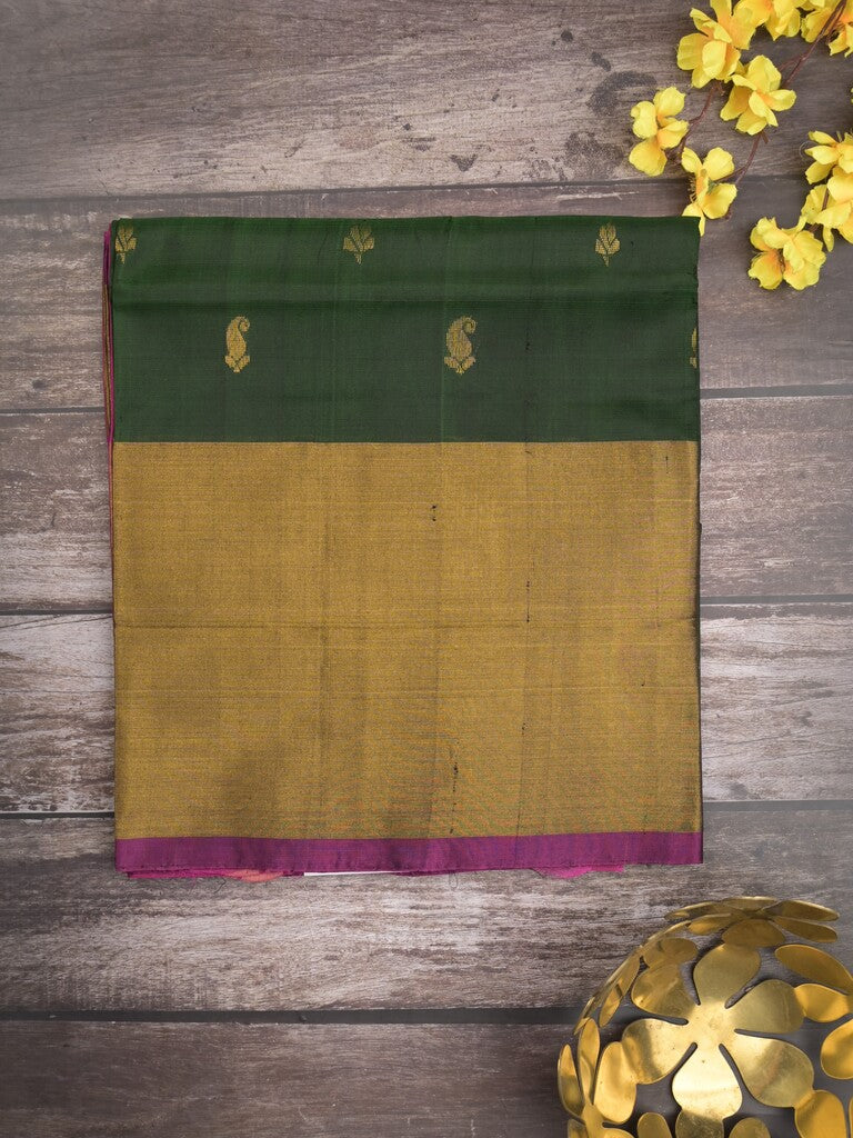 Uppada pattu saree bottle green color allover zari motifs & long kaddi border with rich pallu and contrast plain blouse