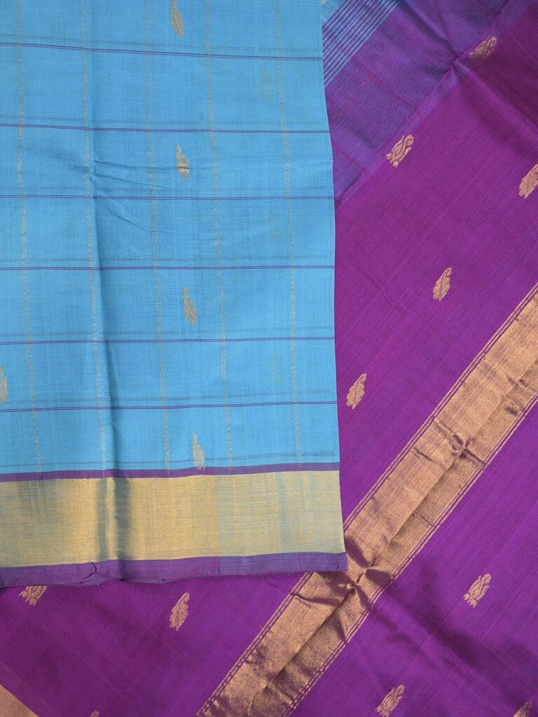 Uppada seiko pattu saree sky blue color allover checks, motifs & zari border with contrast pallu and plain blouse