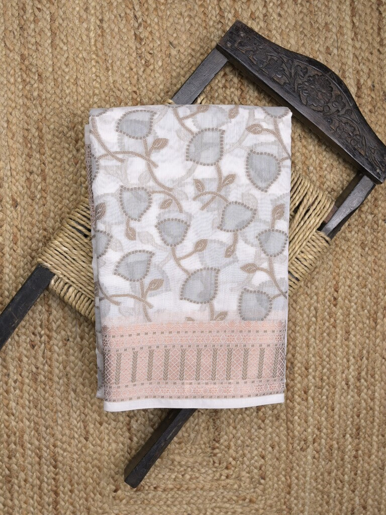 Chanderi fancy saree in white color with allover weaves and zari border with contrast pallu and blouse