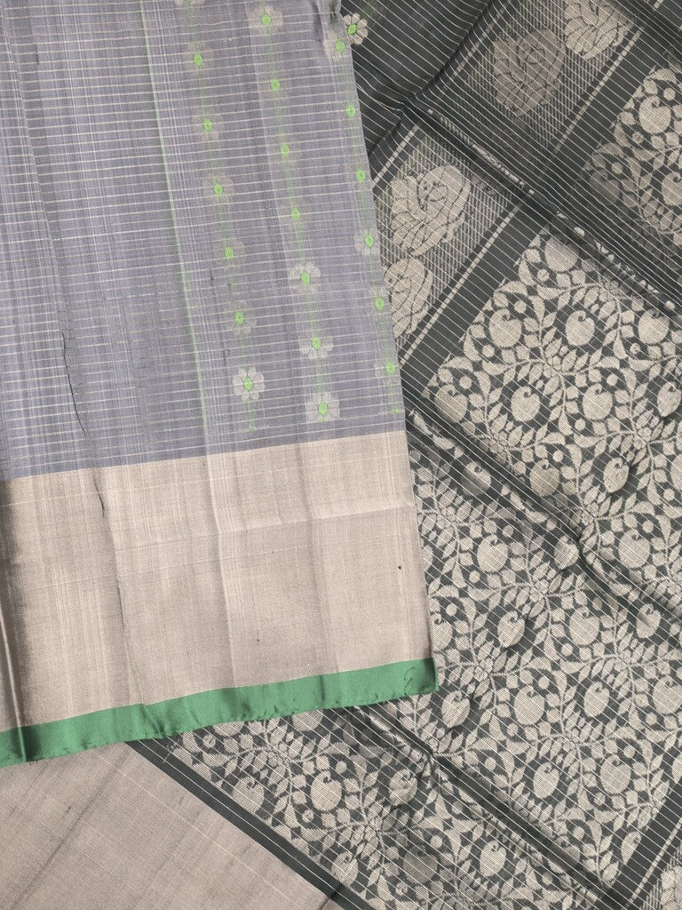 Uppada pattu saree grey color allover zari motifs & long kaddi border with rich pallu and contrast plain blouse