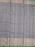 Uppada pattu saree grey color allover zari motifs & long kaddi border with rich pallu and contrast plain blouse