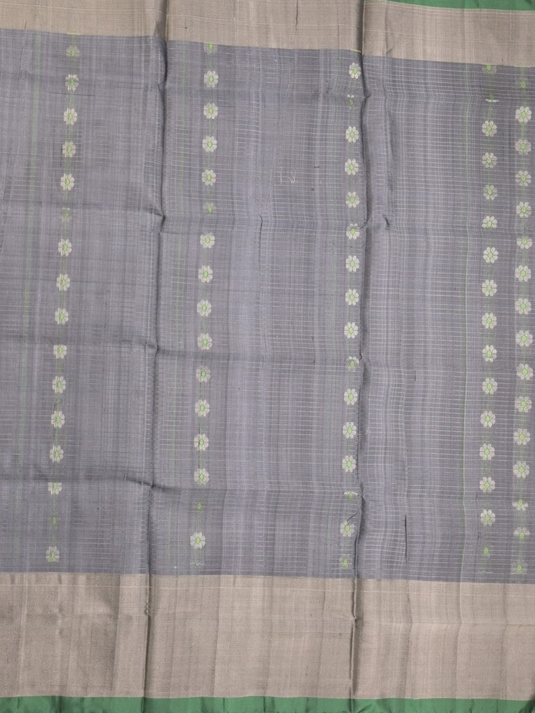 Uppada pattu saree grey color allover zari motifs & long kaddi border with rich pallu and contrast plain blouse
