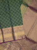 Seiko Raga zari-woven saree in bottle green color with zari border and rich pallu & contrast blouse