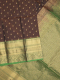 Seiko Raga zari-woven saree in dark brown color with zari border and rich pallu & contrast blouse