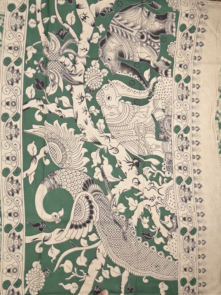 Kalamakari cotton saree green color allover prints & printed border with printed pallu and contrast blouse