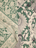 Kalamakari cotton saree green color allover prints & printed border with printed pallu and contrast blouse