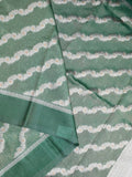 Organza tissue fancy saree light green color allover stripes & small kaddi border with short pallu and attached blouse