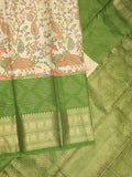 Dola silk fancy saree cream and green color allover prints & zari border with contrast pallu and attached blouse