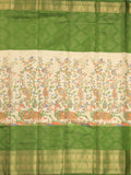 Dola silk fancy saree cream and green color allover prints & zari border with contrast pallu and attached blouse