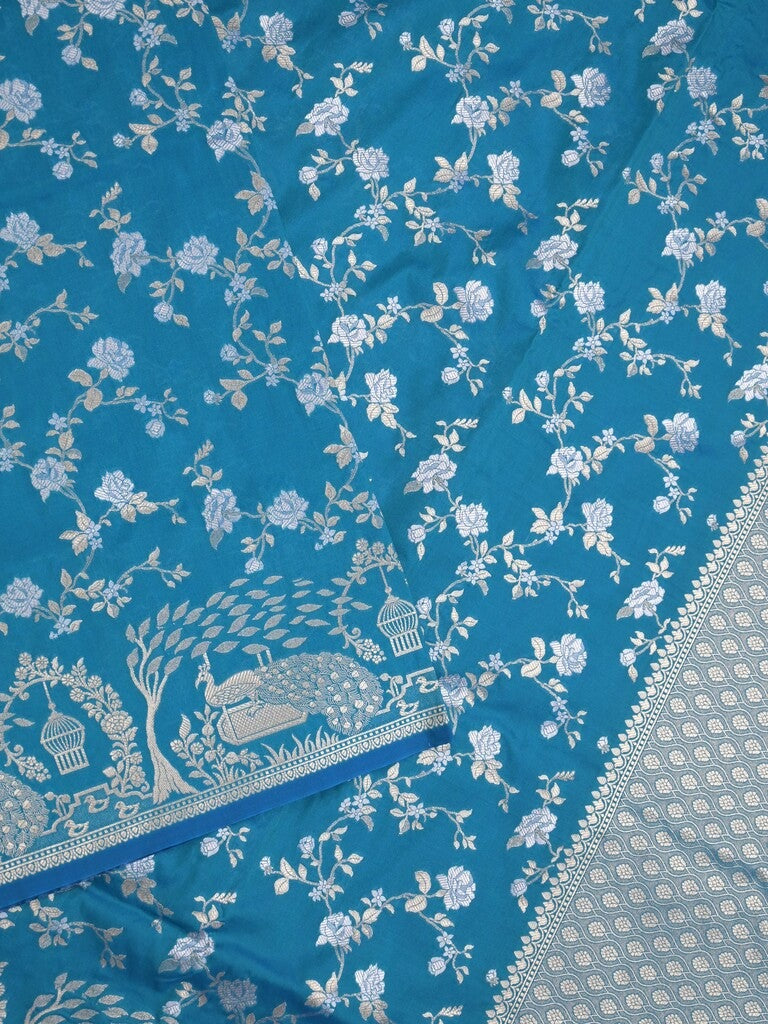 Raw mango fancy saree sky blue color allover zari weaves & zari border with zari border and attached plain blouse