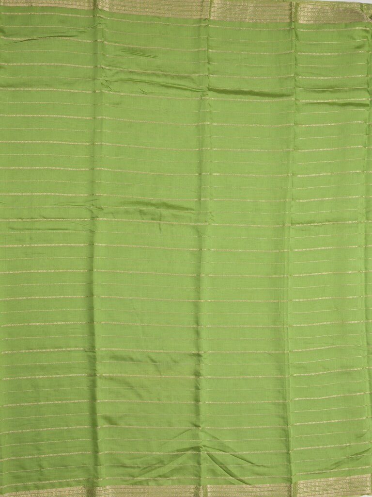 Dola silk fancy saree pista green color allover zari weaves & small kaddi border with short pallu and running blouse