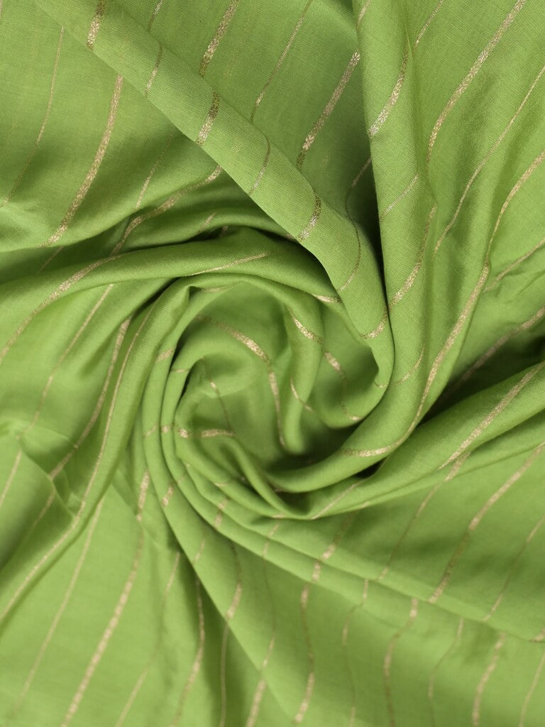 Dola silk fancy saree pista green color allover zari weaves & small kaddi border with short pallu and running blouse
