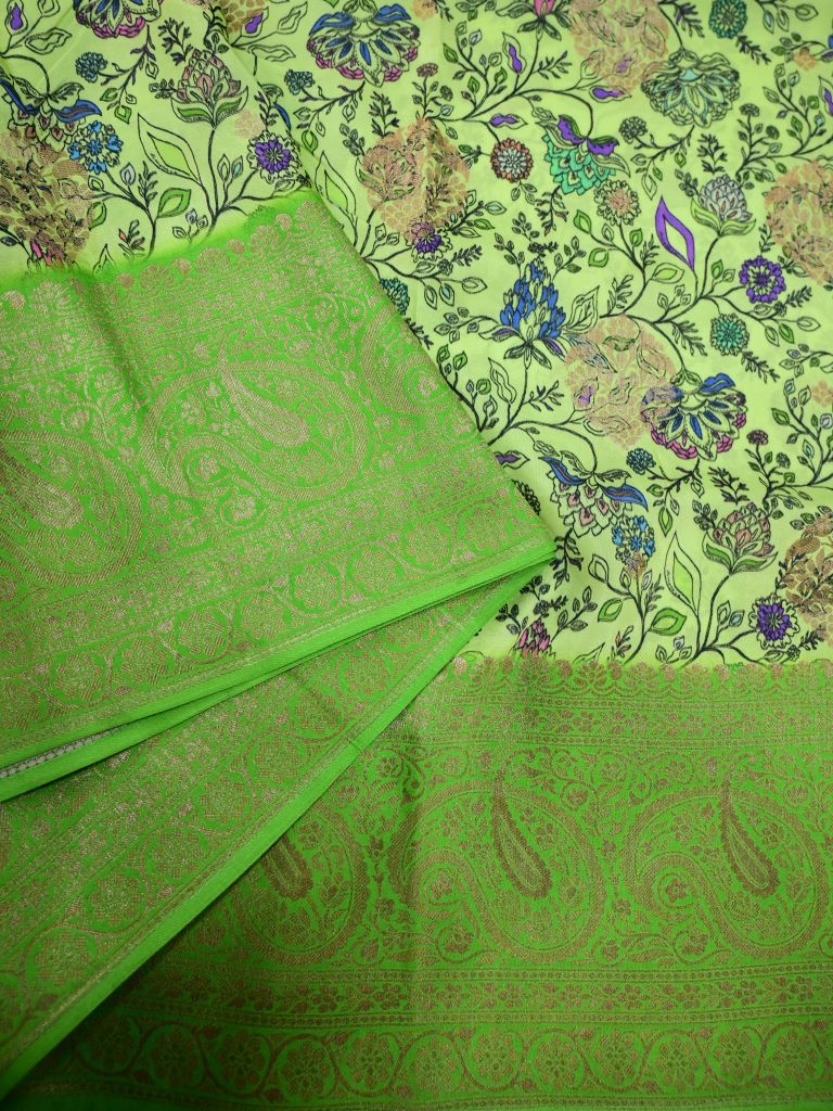 Dola silk fancy saree light green color allover prints & big zari border with rich pallu and plain contrast blouse