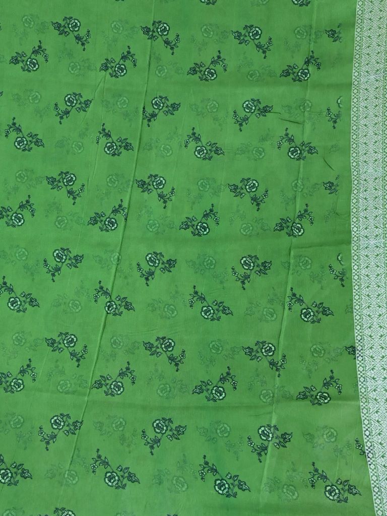 Dola silk fancy saree pista green color allover prints & zari border with short pallu and printed blouse