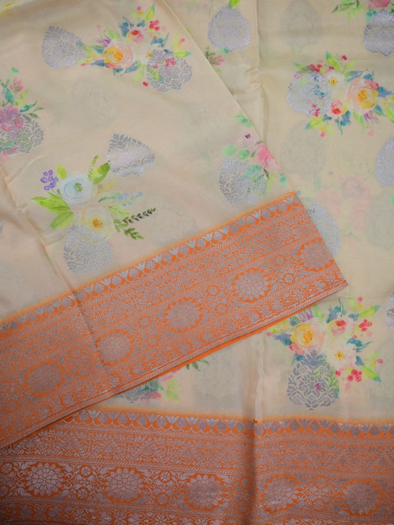 Dola silk fancy saree light yellow color allover prints & zari border with short pallu and printed blouse