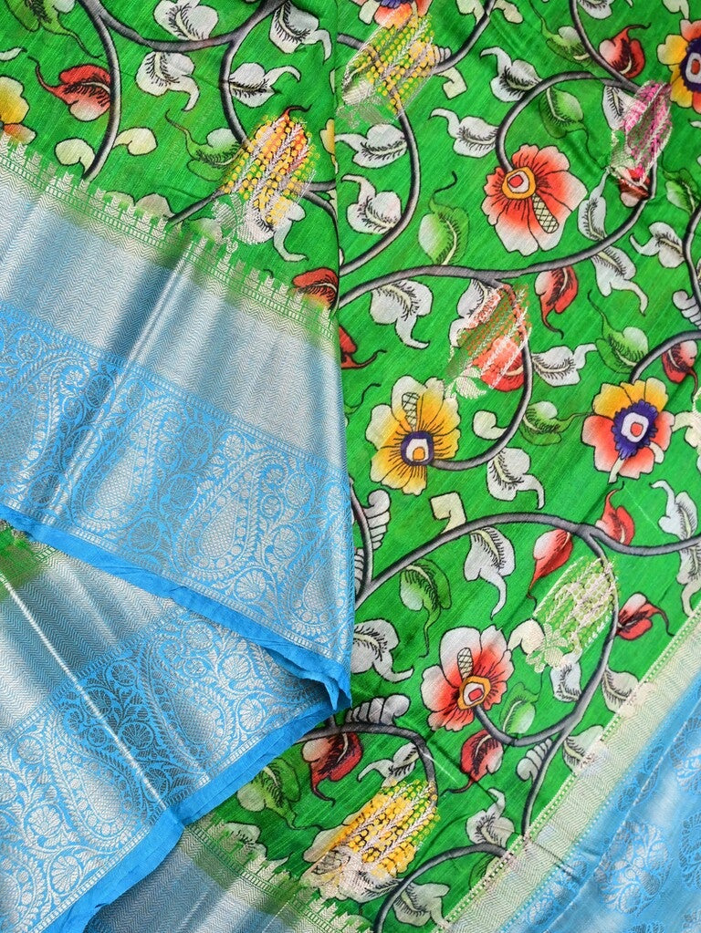 Jute matka fancy saree parrot green color allover prints & big zari border with short pallu and attached brocade blouse