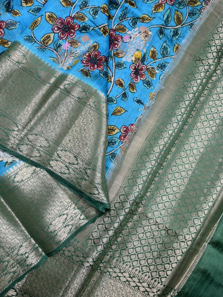 Jute matka fancy saree sky blue color allover prints & big zari border with short pallu and attached brocade blouse